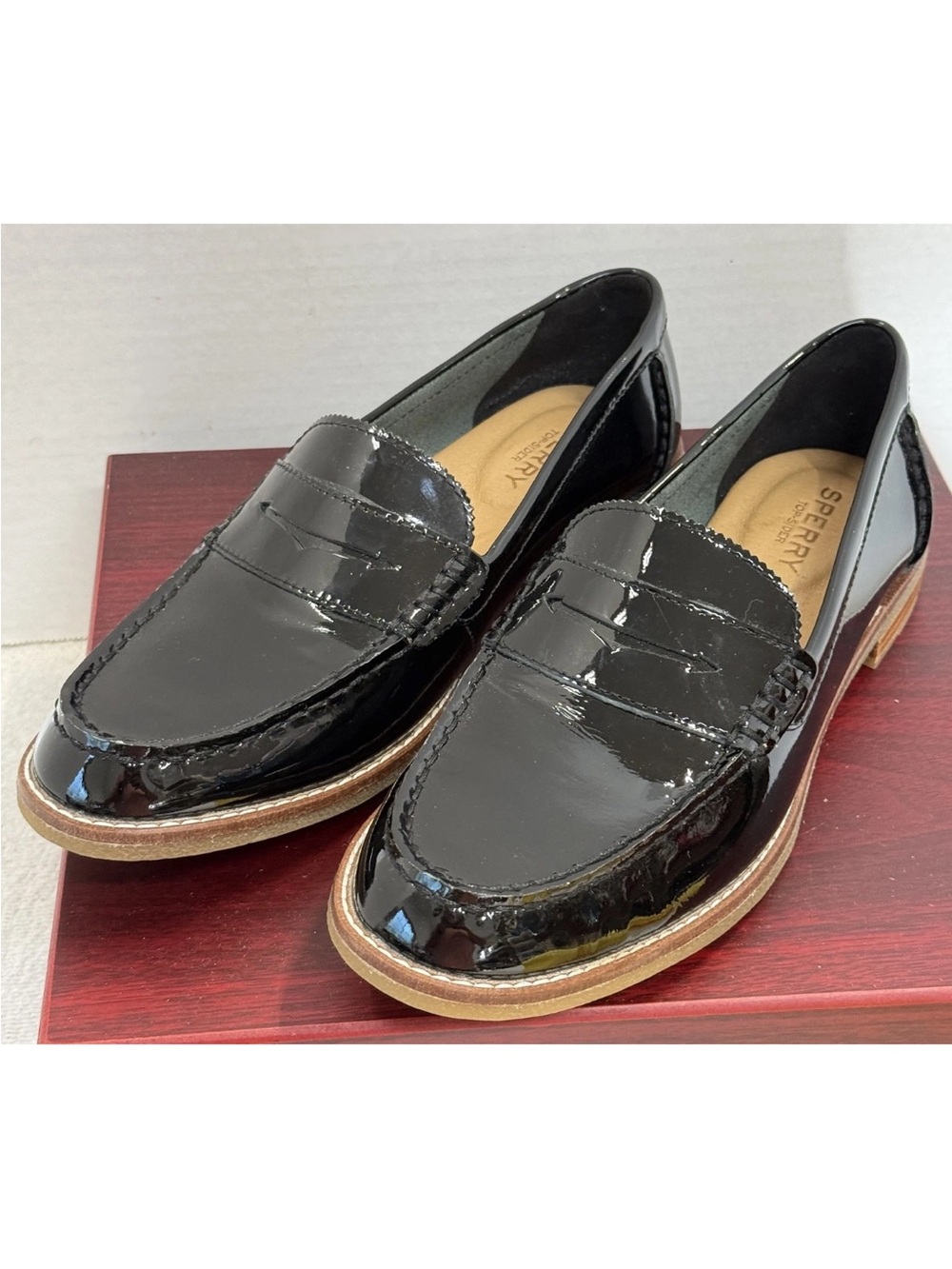 Sperry women’s in Black Patent Leather Penny Loafers with Tan Sole Trim